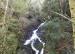 waterfall in winter forest portugal